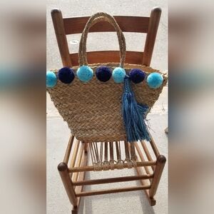Woven tassel and pom pom bag